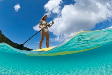 a man riding a surfboard in the water