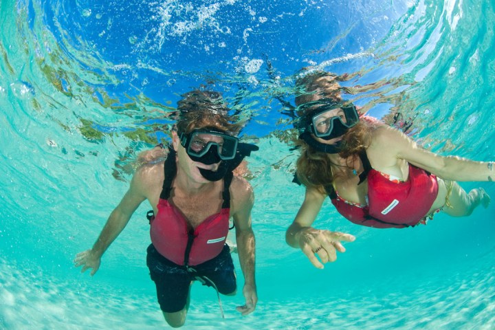 a person swimming in a pool of water